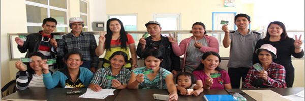 Highland farmers from Benguet present their ATM cards through which they can withdraw their loans under the Production Loan Easy Access (PLEA) program. (Photo by Lordyxon de los Reyes of ACPC)